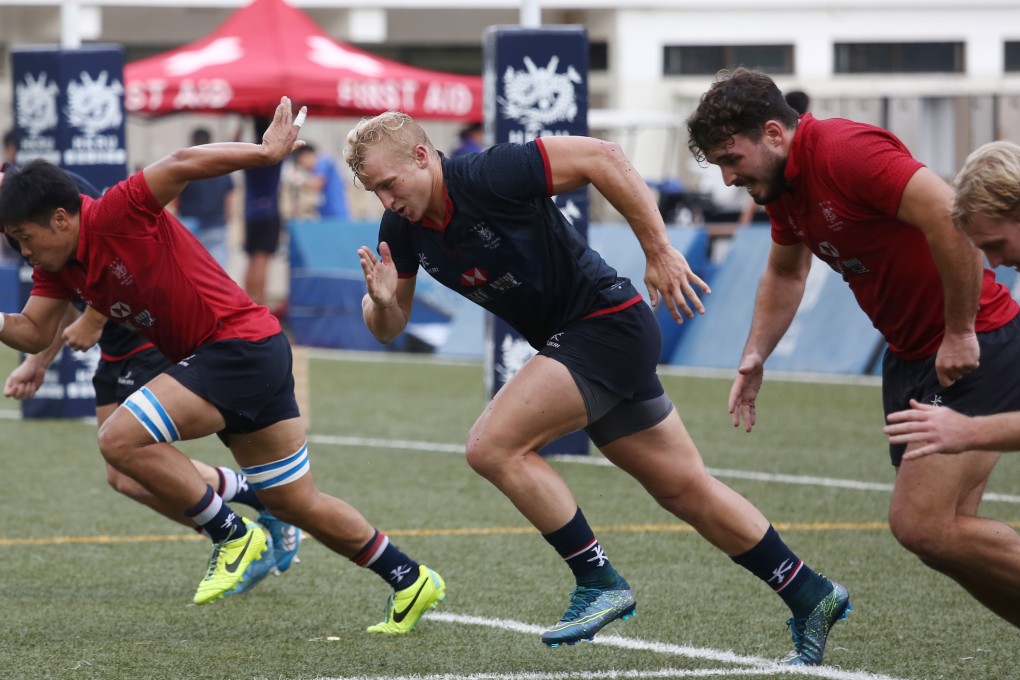 Hong Kong men's sevens squad captain Max Woodward (centre) trains with team-mates at King's Park in Ho Man Tin ahead of next weekend's Asia Rugby Sevens Qualifier for the Rio 2016 Olympics. Photos: Jonathan Wong/SCMP