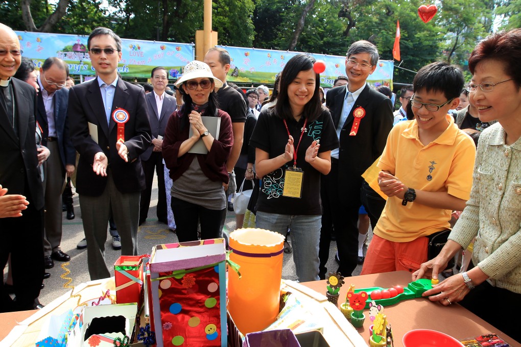 Carrie Lam (far right) has attended the opening ceremony of the Caritas bazaar with Cardinal Tong (left) in the past. Photo: Jonathan Wong