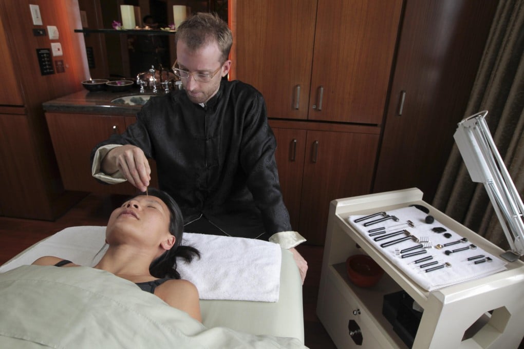 Facial reflexologist Alex Scrimgeour carries out treatment on Jeanette Wang at The Spa at Mandarin Oriental. Photo: Bruce Yan