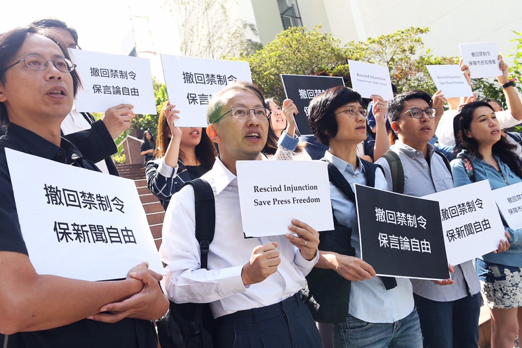 Journalists and teachers shout slogans at HKU on Monday. Photo: Dickson Lee