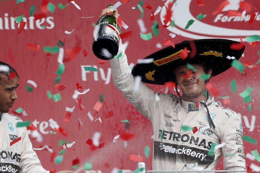 Mercedes' Nico Rosberg celebrates his win ahead of teammate Lewis Hamilton for Mercedes. Photo: Reuters