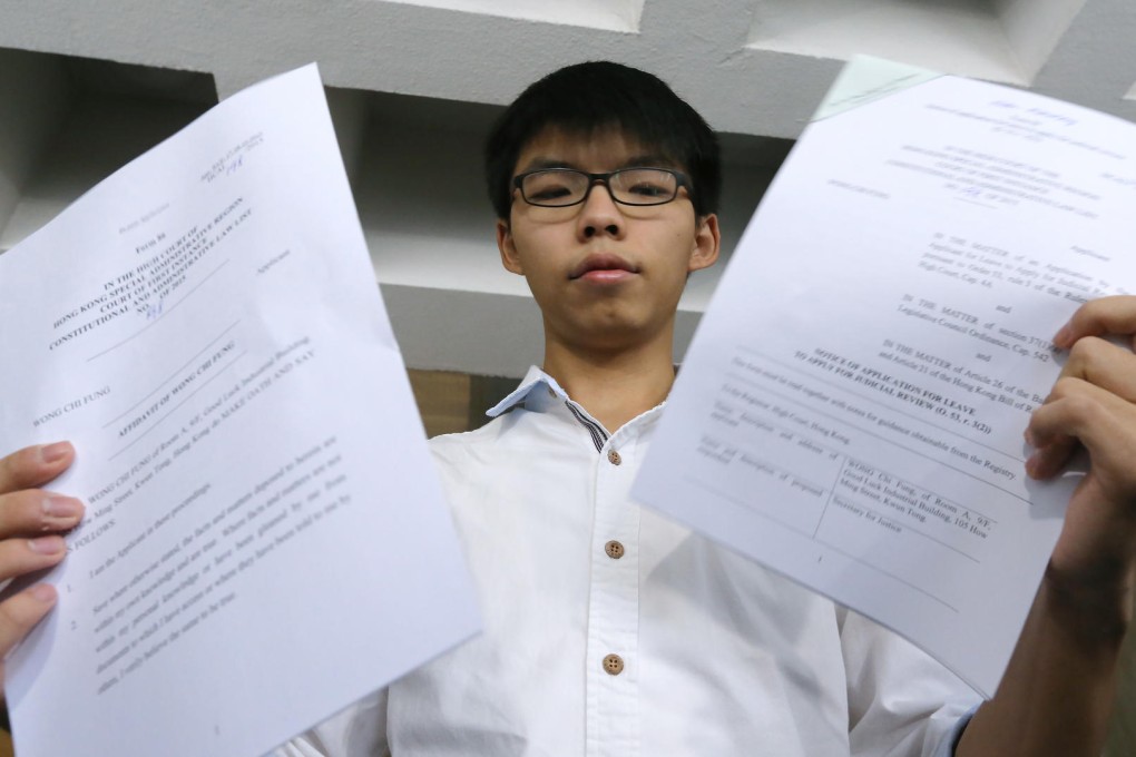 Joshua Wong is challenging the age threshold for running in Legco elections. Photo: Felix Wong