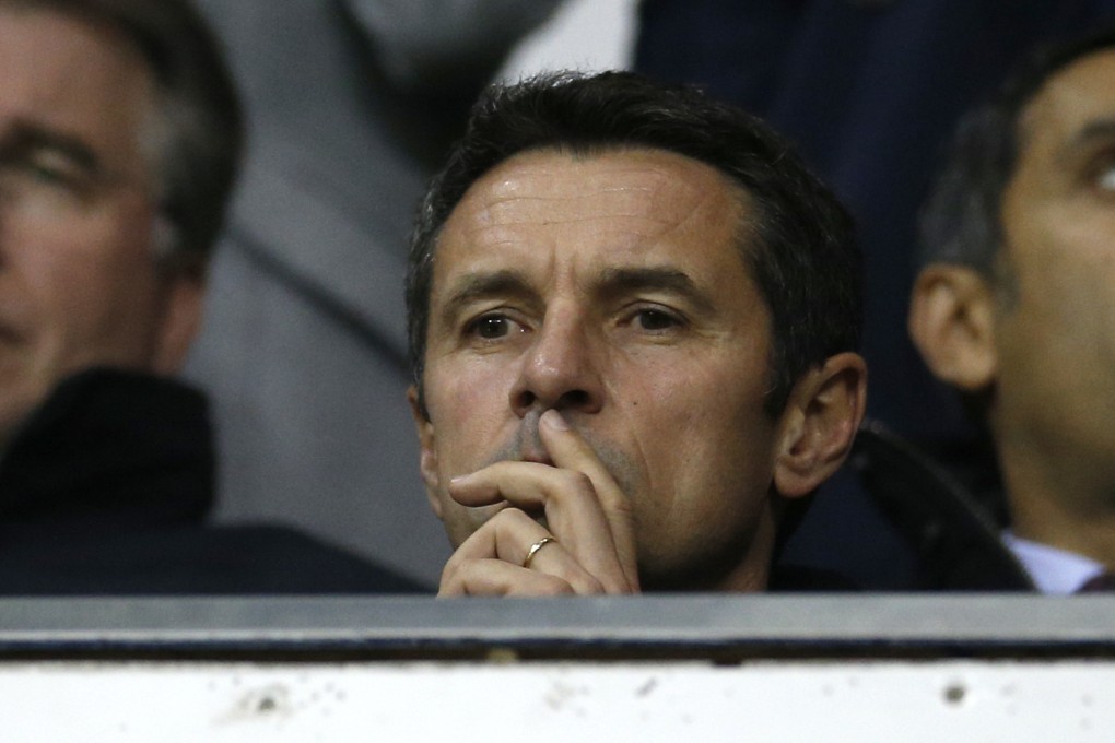 Remi Garde watches from the stands. Photo: Reuters