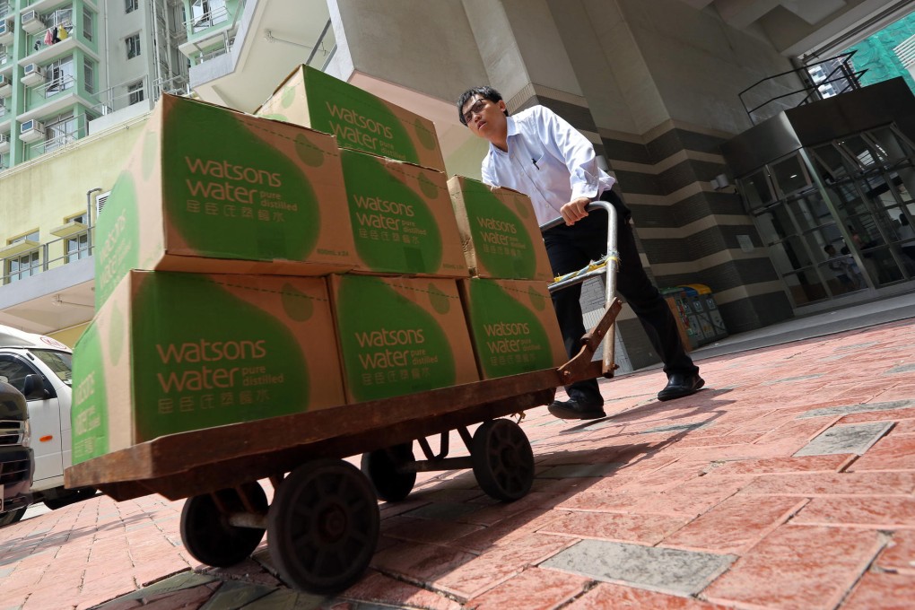 Water bottles are wheeled into Kai Ching Estate for use by tenants. Photo: Nora Tam