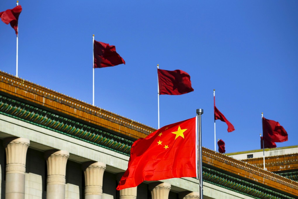 Chinese flag waves in front of the Great Hall of the People, the venue of China's parliament, in Beijing. Photo: Reuters