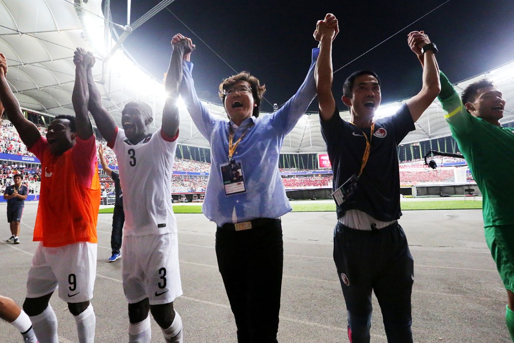 Hong Kong coach Kim Pan-gon (centre) and Hong Kong team in cheers after the draw against China of the 2018 FIFA World cup Qualifier at Baoan Stadium in Shenzhen in September. Photo: Edward Wong