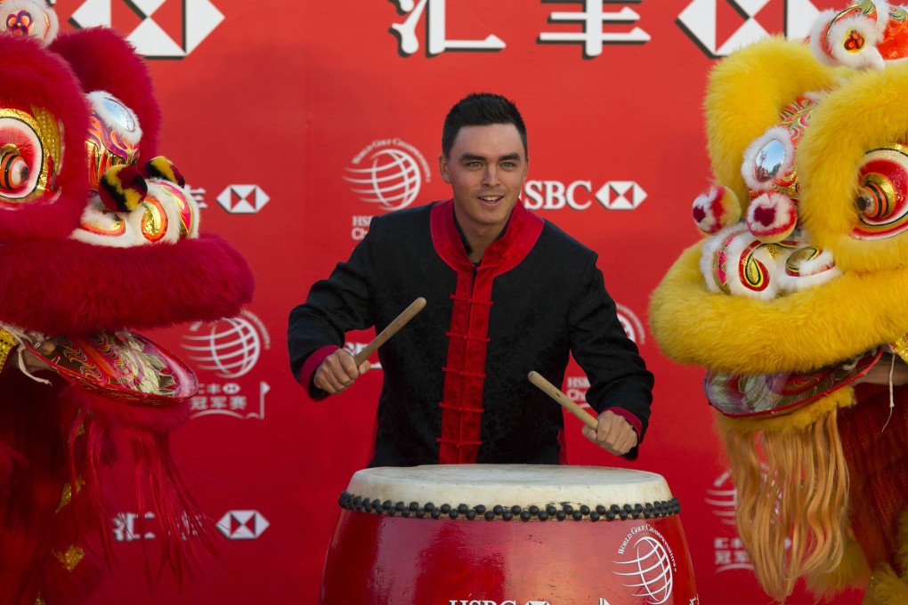 Jordan Spieth wears a traditional Chinese costume on the historic Bund in Shanghai at a celebration marking the start of the WGC-HSBC Champions golf tournament. Photo: AFP