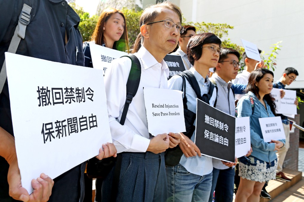 The Hong Kong Journalists Association hold a protest at the University of Hong Kong on Monday to demand the university withdraw its injunction against Commercial Radio and other media from reporting on leaked audio recordings of its council's confidential meetings. Photo: Dickson Lee