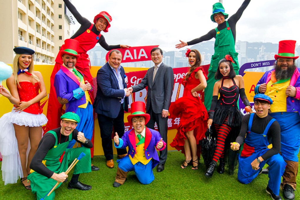 Michael Denmark (centre left), chief executive of the carnival, with some of the event's colourful street performers. Photo: SCMP Pictures