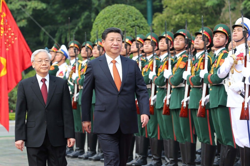 Chinese President Xi Jinping attends a welcoming ceremony held by General Secretary of the Communist Party of Vietnam Nguyen Phu Trong (left) before their talks in Hanoi. Photo: Xinhua