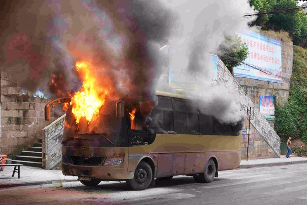 The bus ablaze in Chongqing. Photo: China News Service