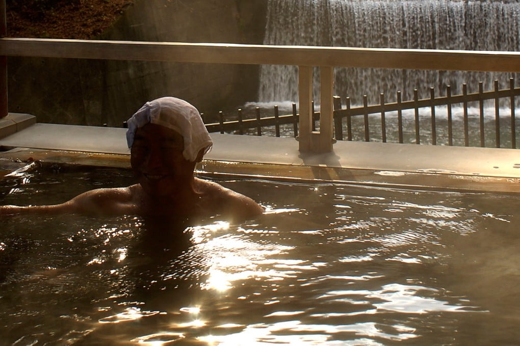 A visitor relaxes in a Japanese hot spring in Guma Prefecture. Photo: Bloomberg