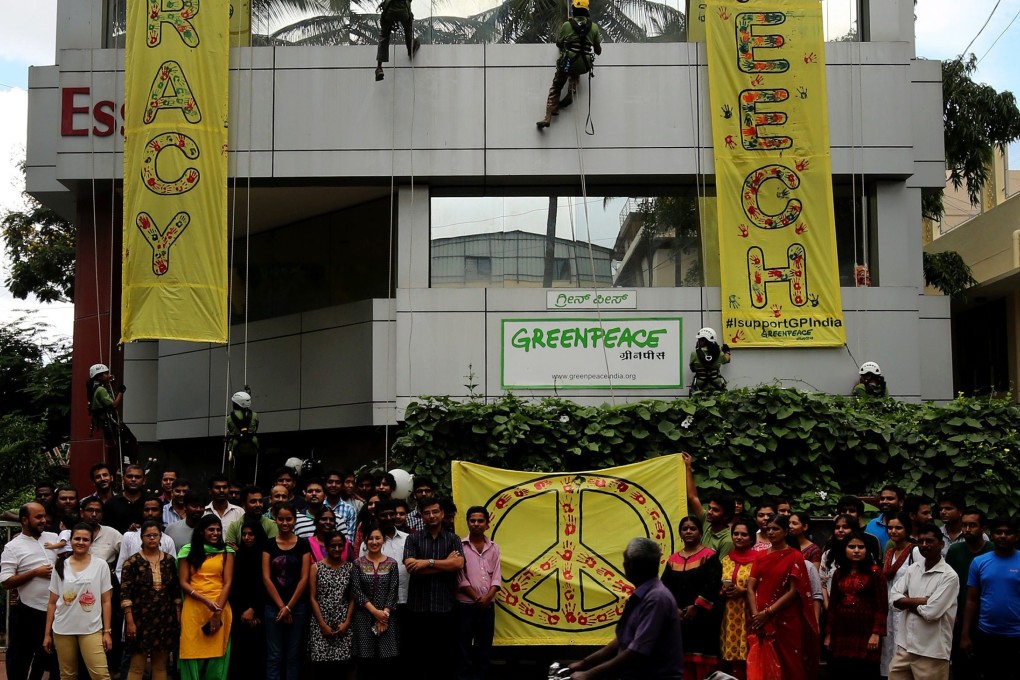 Greenpeace supporters in India during a demonstration in May. Photo EPA