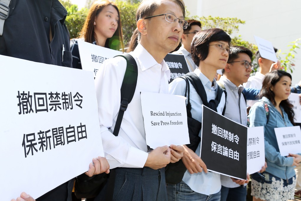 The Hong Kong Journalists Association hold a protest at the University of Hong Kong on Monday to demand the university withdraw its injunction against Commercial Radio and other media from reporting on leaked audio recordings of its council's confidential meetings. Photo: Dickson Lee
