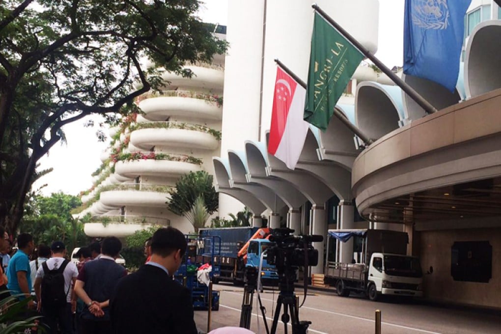 Journalists wait outside the entrance of the Shangri La Hotel in Singapore on Friday. Photo: Zhen Liu