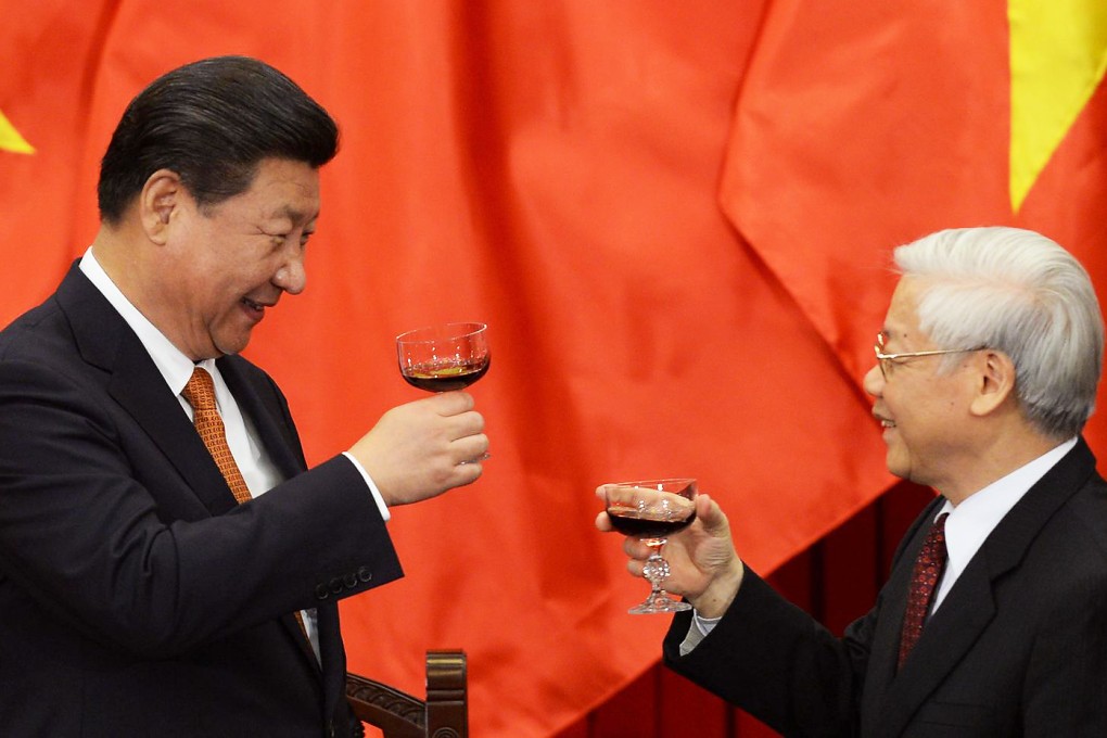 President Xi Jinping raises a toast with Vietnam's Communist Party General Secretary Nguyen Phu Trong following talks in Hanoi yesterday. Photo: AFP