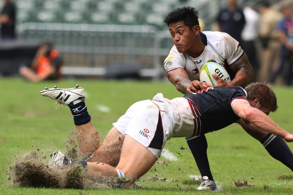The sand flies during a game yesterday. Photo: Edward Wong