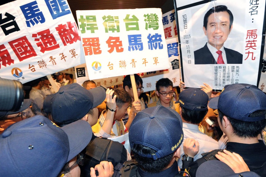 Pro-independence protesters clash with police at Taipei's Taoyuan airport yesterday. Photo: AFP