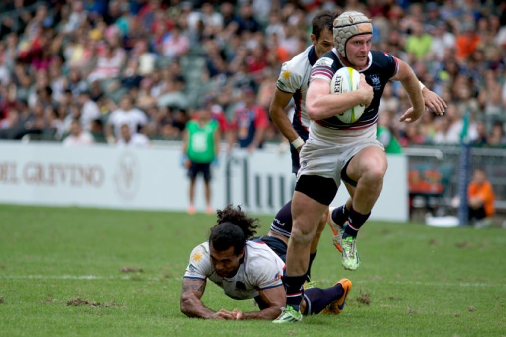 Hong Kong's Jamie Hood on the charge against the Philippines on day one of the 2015 Asia Rugby Olympic Sevens Qualifiers at Hong Kong Stadium on 7 November. Photo: Asia Rugby