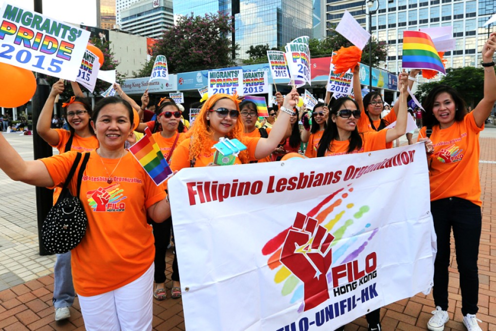 Brightly attired Filipino helpers walk to Chater Road to show solidarity with a gay pride march held the day before. Photos: Edward Wong