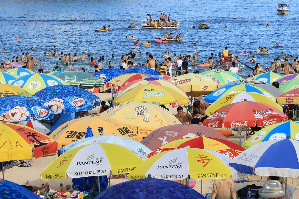 Crowds at Shek O earlier this year. Despite winter officially arriving in Hong Kong this weekend, temperatures hit 30 degrees. Photo: Franke Tsang