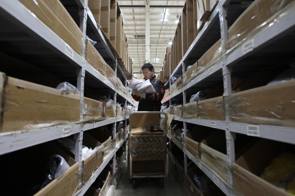 Workers at delivery company Beijing Rufengda Express prepare yesterday for the Singles Day rush. Photo: Simon Song