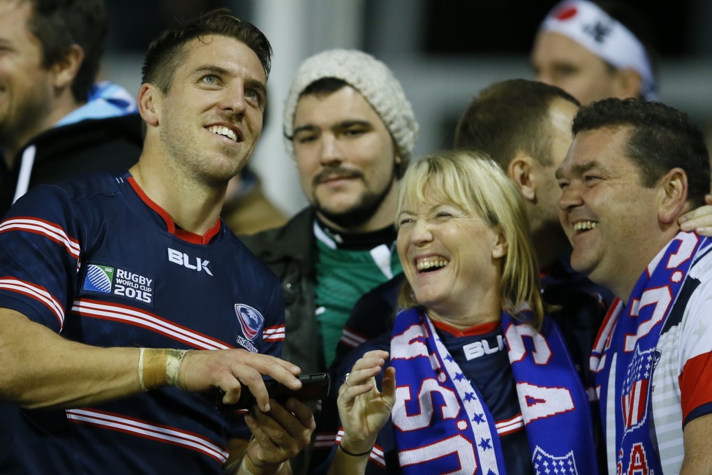 USA rugby captain Chris Wyles poses with fans during the Rugby World Cup in England. Photo: AP