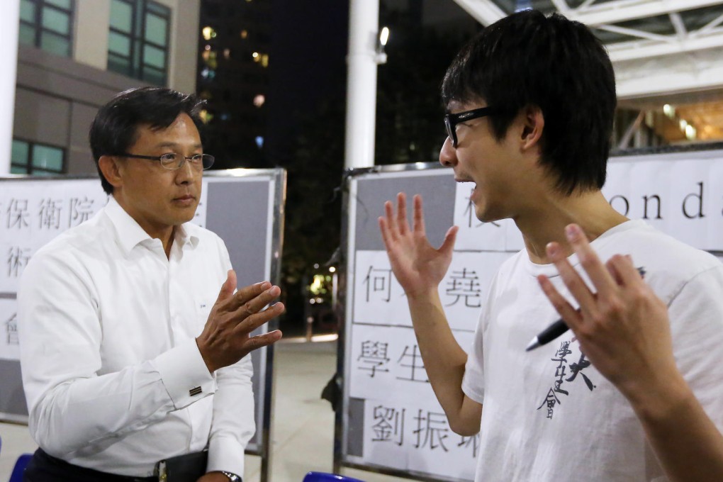 Lingnan University's newly-appointed council member Junius Ho, left, saw red following a question from students' union president Philip Lau.Photo: Felix Wong