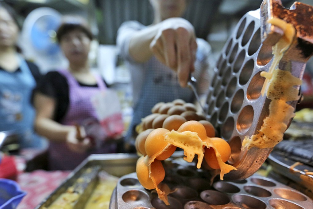 Lee Keung Kee's egg waffles in North Point is among the street food included in the Hong Kong and Macau Michelin Guide for the first time. Photo: Edward Wong