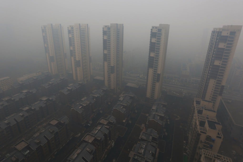 Residential buildings in Shenyang are shrouded in smog on Sunday. Photo: Reuters