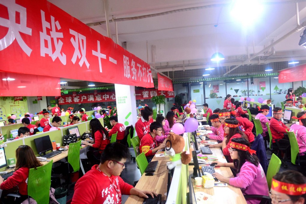 Employees at snacks retailer Three Squirrels communicate with shoppers online during China's Singles Day. Photos: Xinhua
