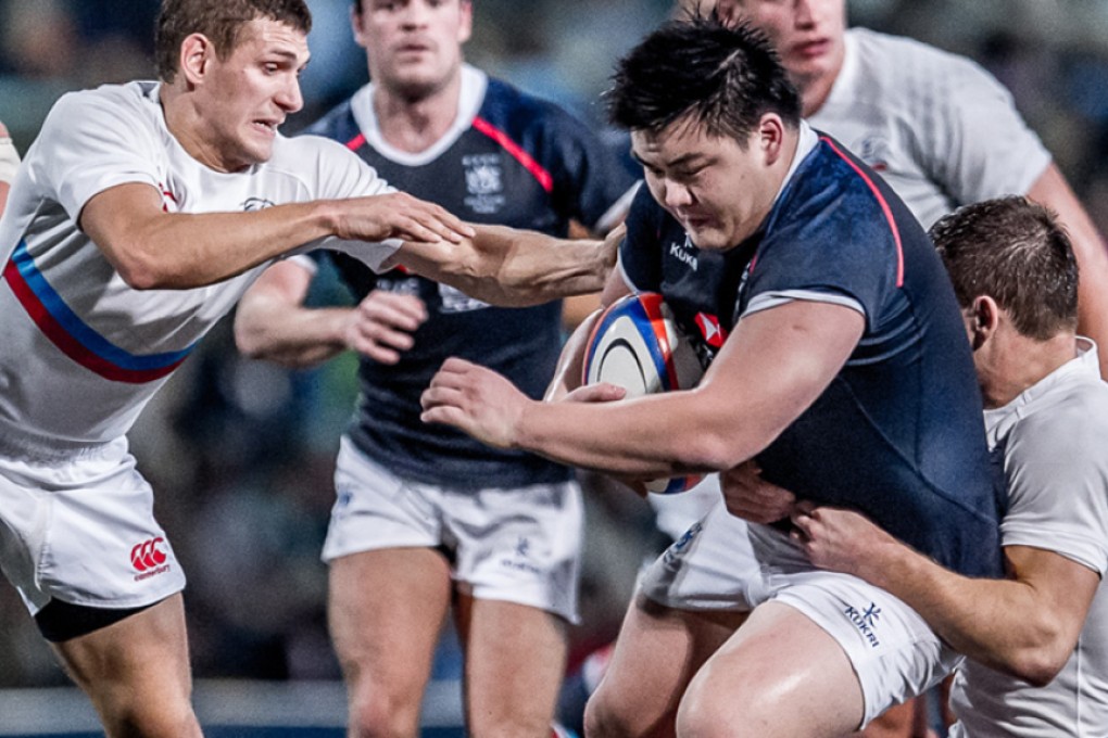 Hong Kong prop Leon Wei takes on the Russia defence in last year's Ustinov Cup. Wei and his team-mates were back in action Friday in the 2015 Hong Kong Cup of Nations featuring Russia, Portugal and Zimbabwe. Photo: HKRU