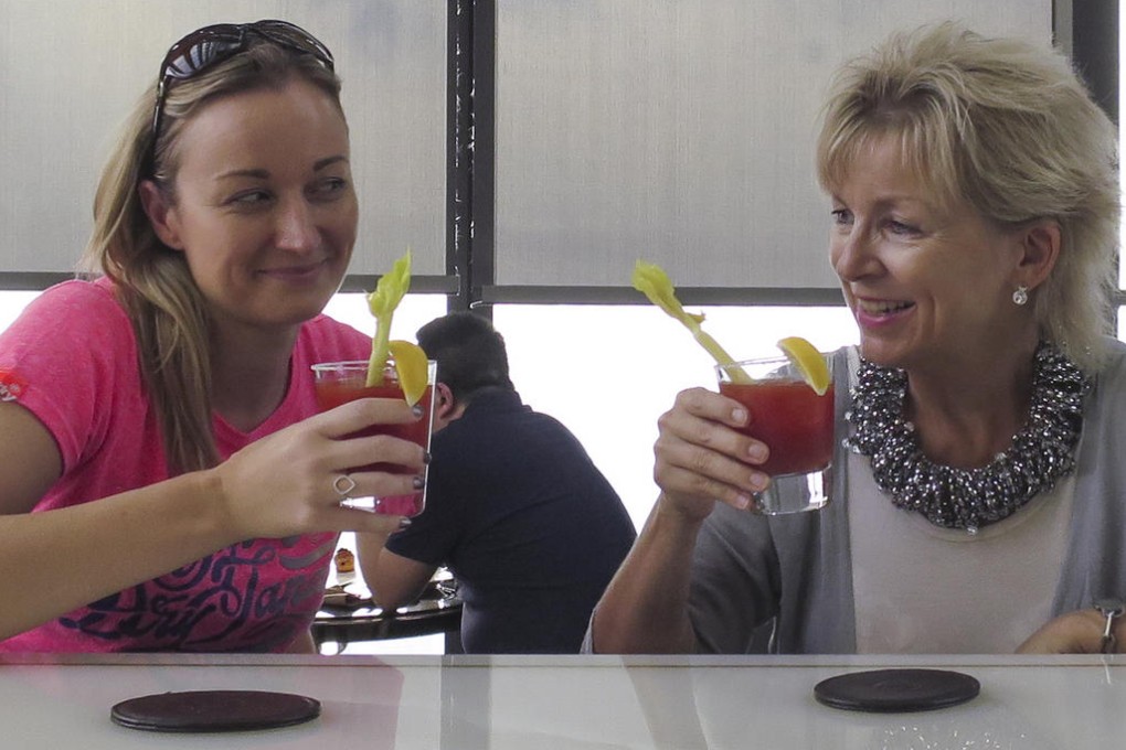 Cecilie Gamst Berg (right) and J, at the bar in the St Regis Hotel, Shenzhen.