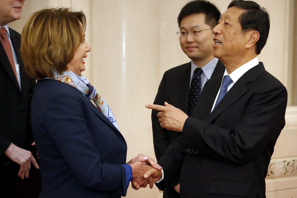 Visiting US politician Nancy Pelosi speaks with with Zhang Ping, Vice-Chairman of the National People's Congress. Zhang asked the US House of Representatives Minority Leader about her visit to Tibet, which had not been announced. Photo: EPA