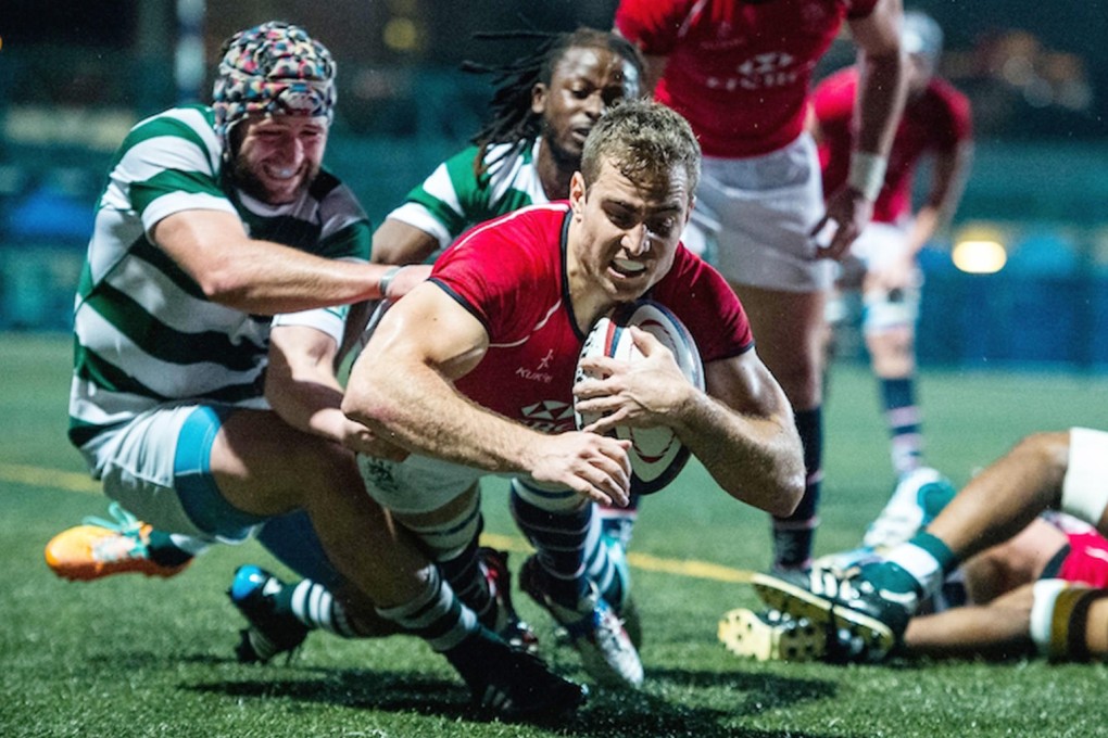 Hong Kong scrum-half Tom Marshall dives over to score against Zimbabwe in their Cup of Nations match on Friday. Photos: HKRU