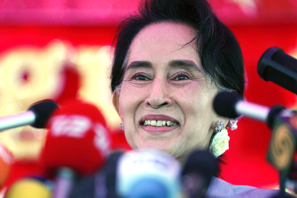 Leader of Myanmar’s National League for Democracy party Aung San Suu Kyi speaks to the press at her residence in Yangon. Photo: EPA