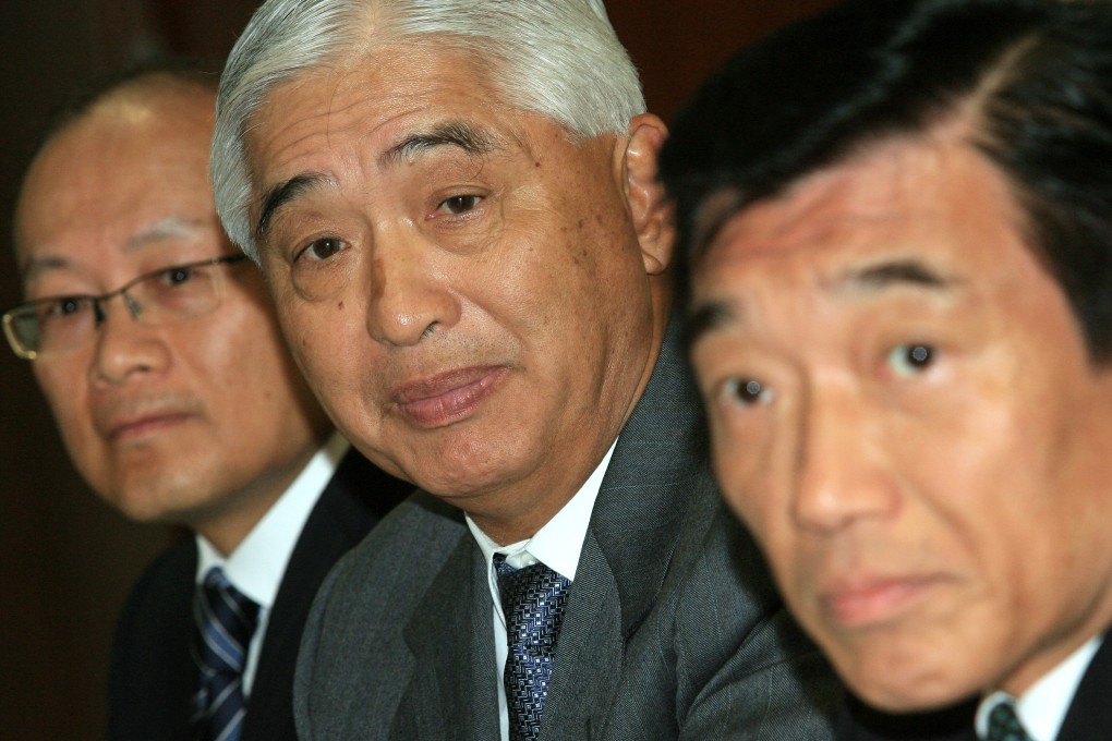 Larry Ying (centre), with Peter Lee (centre) and Henry Fan. Photo: Edward Wong