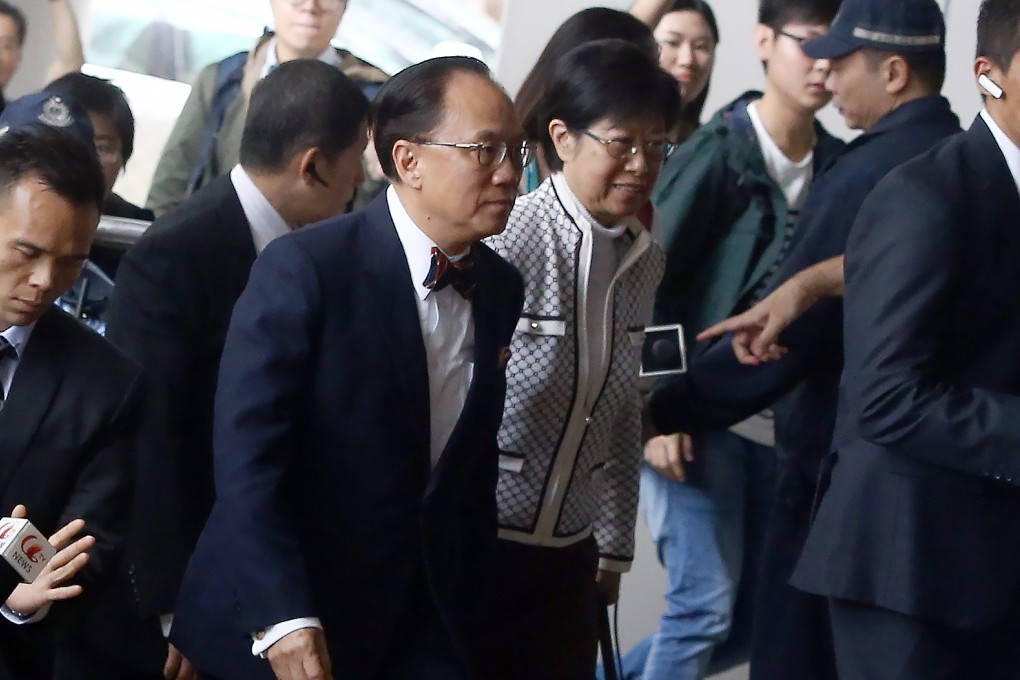 Donald Tsang Yam-kuen (centre) and his wife Selina Tsang Pou Siu-mei arrive at the Eastern Court for a hearing amid increased security. Photo: Sam Tsang