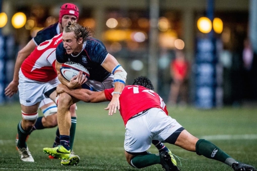 Hong Kong winger Tom McQueen attempts to carve through the Portugal defence in their Cup of Nations match. Hong Kong won 13-6. Photo: HKRU