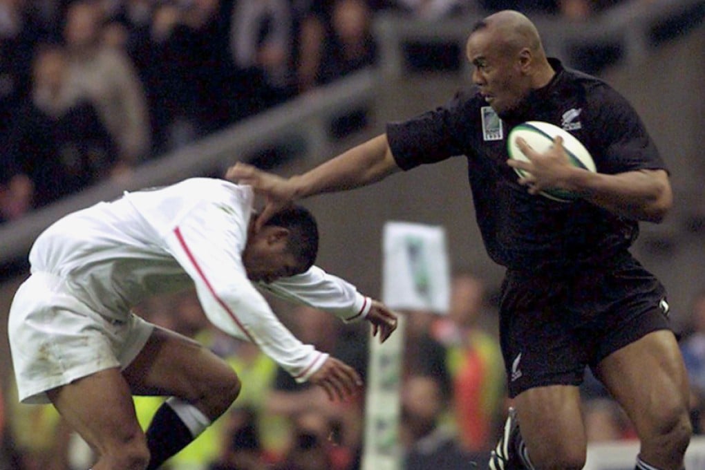 New Zealand's Jonah Lomu pushes off Jeremy Guscott of England during their 1999 Rugby World Cup match at Twickenham. The All Blacks great, who revolutionised wing play to become rugby union's first global superstar, died in Auckland on November 18, 2015 at the age of 40. Photo: Reuters