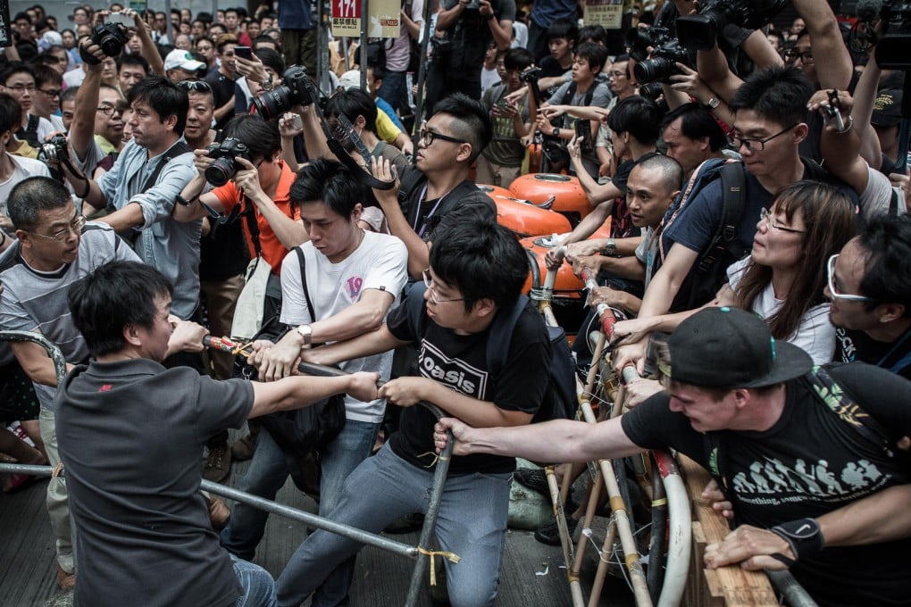Pro-democracy protesters clash with rival protest groups in Mong Kok, in October last year. Photo: AFP