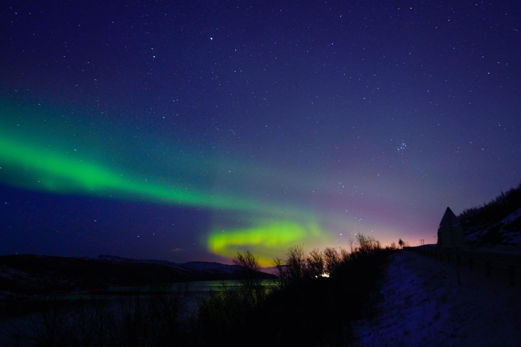 The Aurora Borealis illuminates the night sky near the town of Kirkenes in northern Norway. Photo: AFP