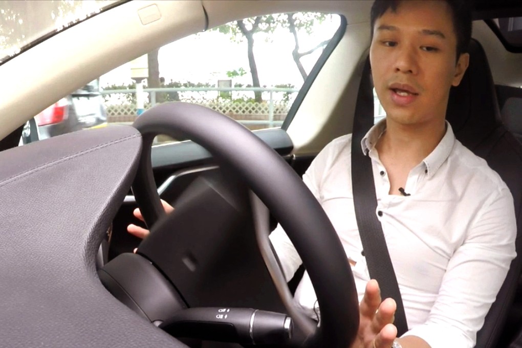 Locky Law, the Tesla owner representative at Charged Hong Kong, test driving an electric vehicle’s autopilot system. Photo: SCMP Pictures