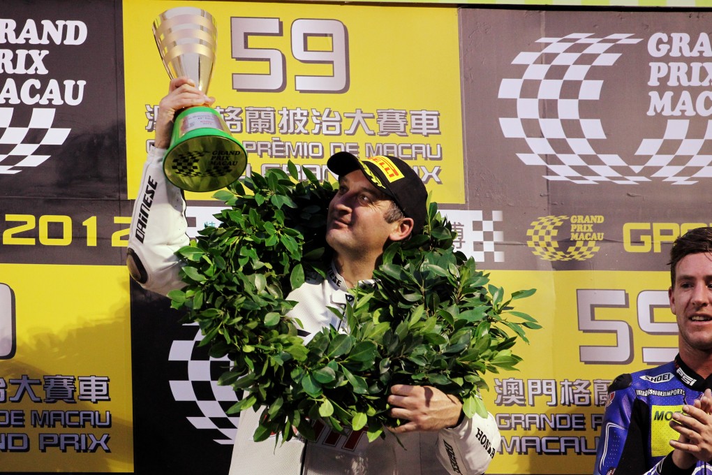 Michel Rutter savours the moment on the podium after winning in 2012. Photo: Nora Tam