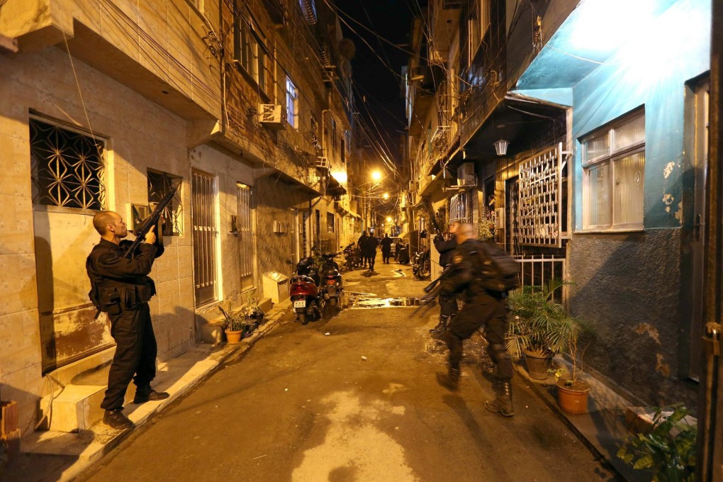 Brazilian officers conduct a raid.