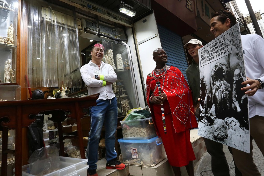 (Second from left to right) Kenyan Daniel Ole Sambu, the Ol Jogi conservancy's Jamie Gaymer, and TV personality Sean Lee-Davies with an ivory shopkeeper. Photo: Jonathan Wong