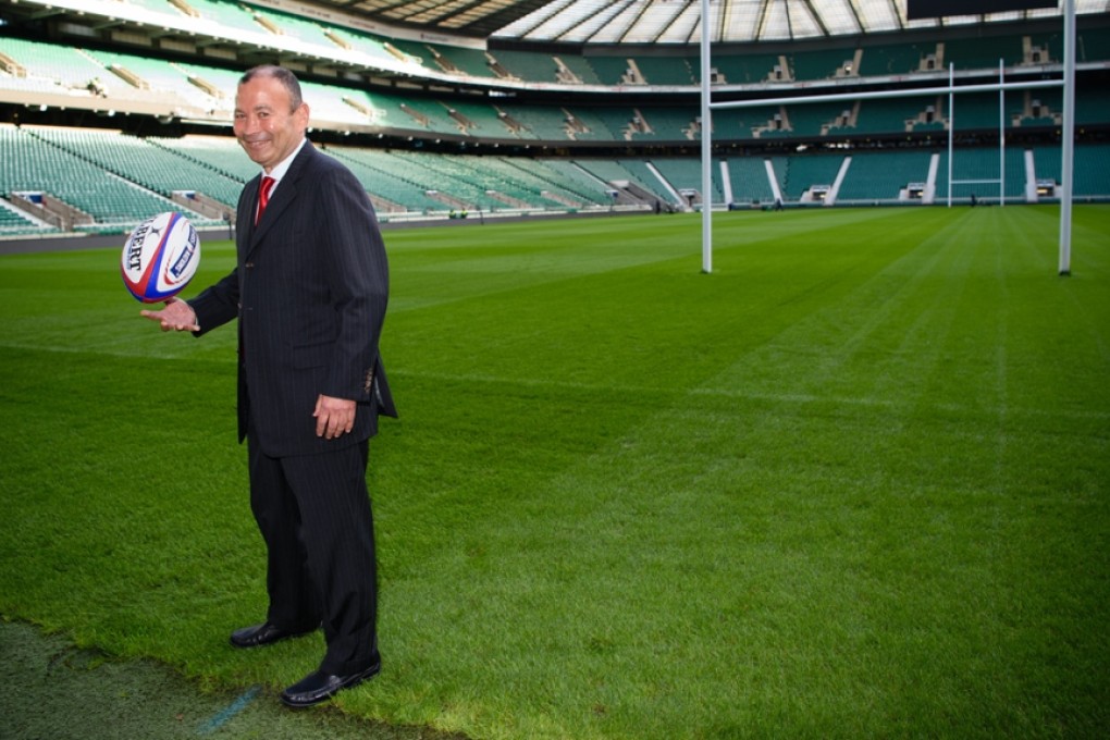 Eddie Jones poses for photographers on Friday at a Twickenham press conference to announce his appointment as the new head coach of England’s national team. Photos: AFP