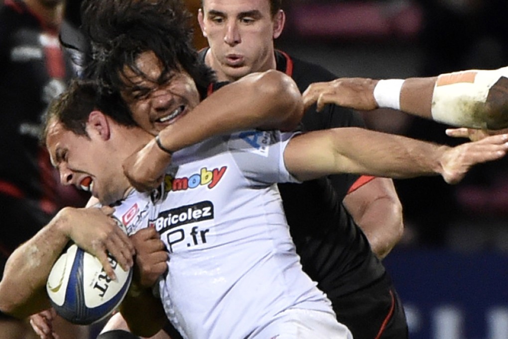 Toulouse flanker Talalelei Gray from Australia (centre rear) wraps up Oyonnax hooker Jeremie Maurouard during their European Rugby Champions Cup at the Stade Ernest Wallon in Toulouse on Saturday. Photos: AFP
