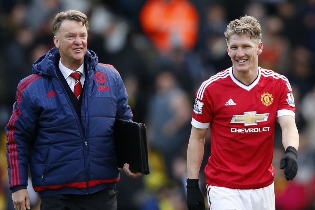 Manchester United's Bastian Schweinsteiger and manager Louis Van Gaal celebrate a hard-fought win at Watford. Photo: Reuters