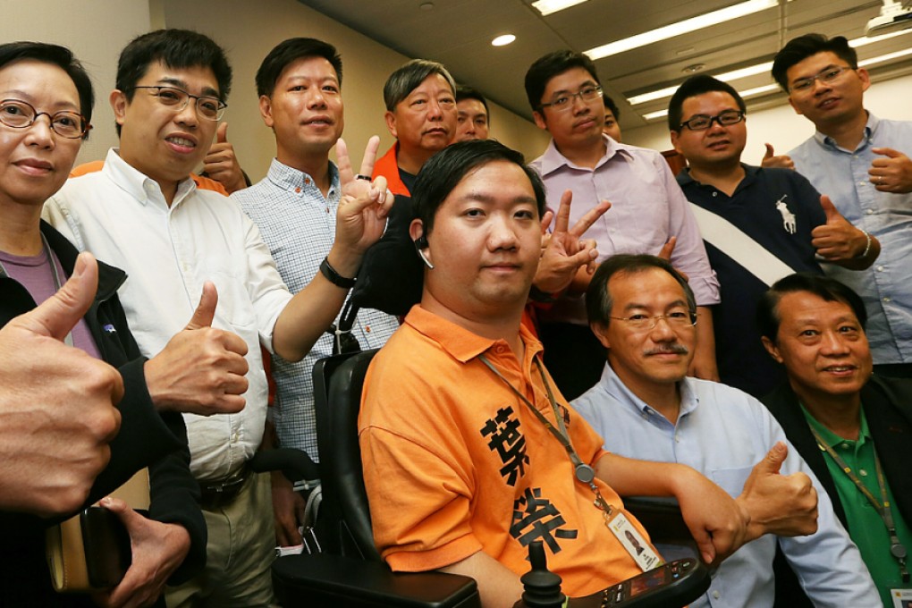 The Labour Party’s Yip Wing (centre) scored an upset over Elizabeth Quat of DAB in yesterday’s poll. Photo: Edward Wong